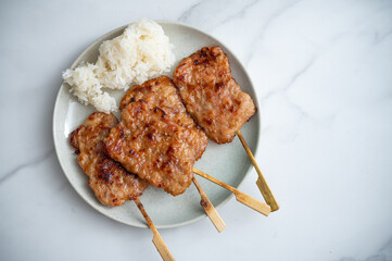 Grilled Pork Skewered  with Sticky Rice - Thai Street Food