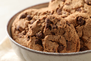 Delicious chocolate chip cookies in bowl, closeup
