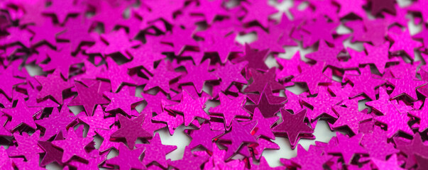 Obraz premium Abstraction from confetti in the form of stars. Star confetti. Bright pink texture.