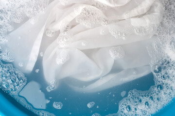 Obraz na płótnie Canvas Soak a cloth before washing, white cloth