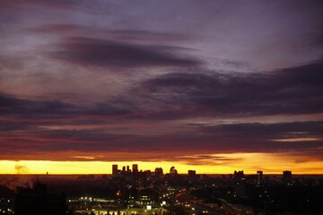 Naklejka premium clouds over city