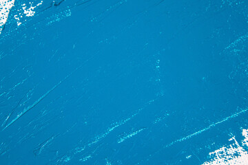 saturated blue abstract background, applied toning primer on a white surface