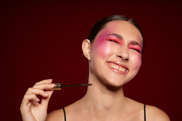 Obraz premium pretty woman pink face makeup posing attractive look skin care pink background unaltered