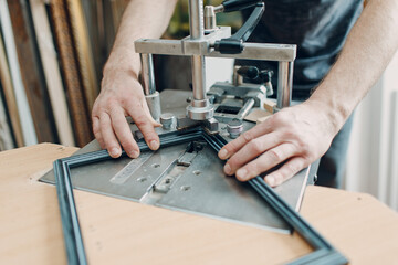 Framing Workshop. Making staples corners brackets baguette handmade picture frame at studio.