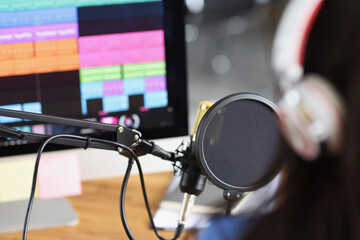 Professional gamer in headphones broadcasting online video games computer monitor