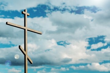 Dramatic religious church cross framed against a moody sky