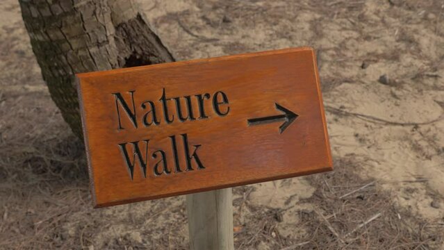 Wooden Board Sign That Read Nature Park With Arrow In QLD, Australia. - close up