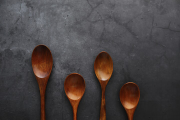 Wooden spoons with spices. A mixture of peppers and spices. Fragrant herbs for food.