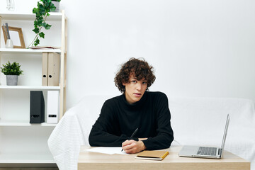guy laptop sitting on white sofa online training communication