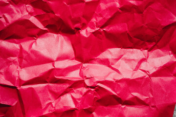 The crumpled red paper texture.