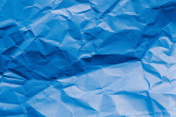 crumpled blue paper background