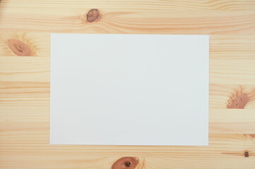 white paper on wood table