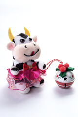 Colorful stuffed toy.The cow. The bell.