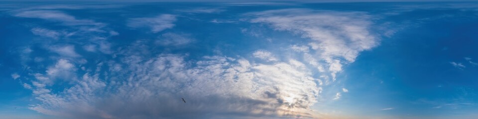 Obraz premium Blue sky panorama with Cirrus clouds in Seamless spherical equirectangular format. Full zenith for use in 3D graphics, game and editing aerial drone 360 degree panoramas for sky replacement.