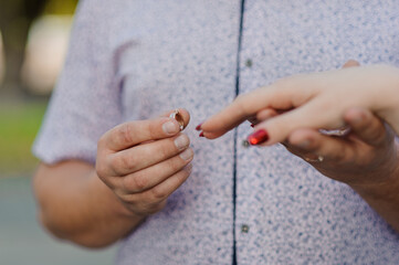 An offer of marriage. Golden ring on a woman's hand