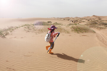 Chinese tourists trekking in Alxa desert