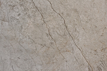 Texture of gray granite imitation of natural stone. Warm light monochromatic porcelain stoneware background