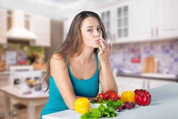 Obraz na płótnie Canvas Happy young attractive woman who eats food