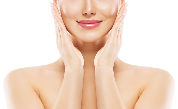 Woman Lips Close up. Beauty Model Smooth Skin Care. Smiling Girl Massaging Face Cheeks. Hands with Nude Nail Polish applying Facial Cream over White Isolated