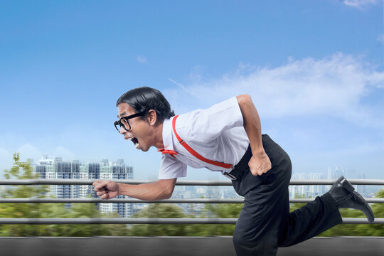 Asian nerd with ugly face running on the street