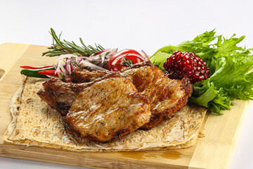 Grilled pork loin served onion