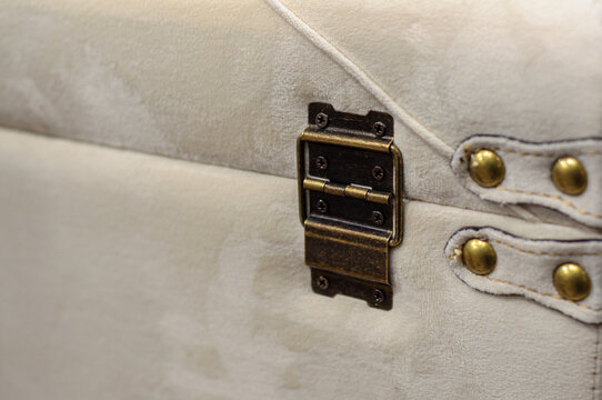 Antique retro furniture hinge, dark distressed, padded pouffe in velvet with studs