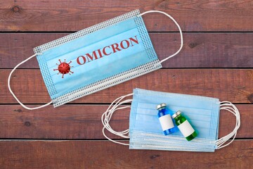 Face mask with Omicron variant text on it. Covid-19 new variant