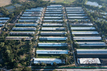 Animal farming and landscape in aerial or top view consist of many building, factory or plant in...