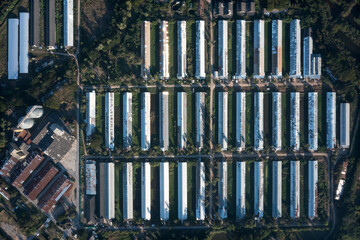 Animal farming and landscape in aerial or top view consist of many building, factory or plant in...