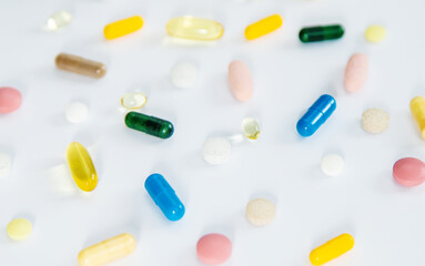 Supplements and vitamins on a white background. Selective focus.