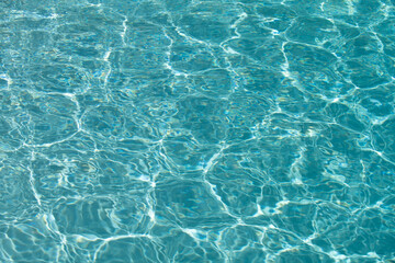 Water in swimming pool, background with high resolution. Wave abstract or rippled water texture.