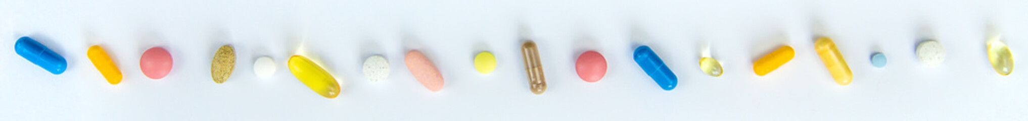 Supplements and vitamins on a white background. Selective focus.