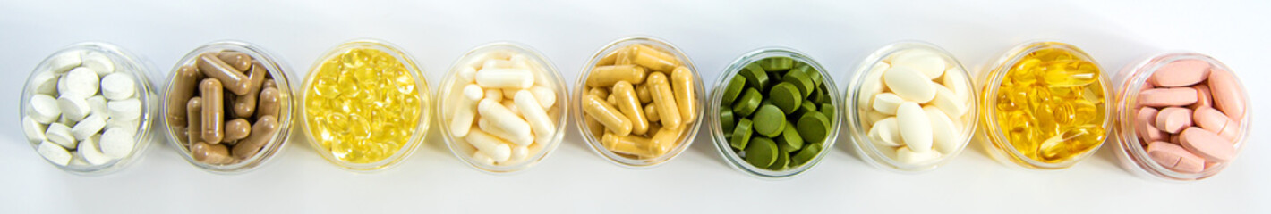 Supplements and vitamins on a white background. Selective focus.