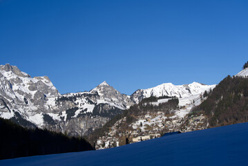 Aerial view of mountain panorama at the Swiss Alps seen from ski resort Engelberg, focus on...