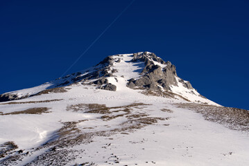 Aerial view of mountain panorama at the Swiss Alps seen from ski resort Engelberg, focus on background. Photo taken February 9th, 2022, Engelberg, Switzerland.