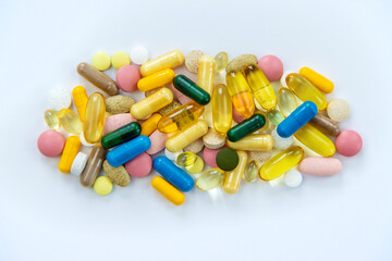 Supplements and vitamins on a white background. Selective focus.