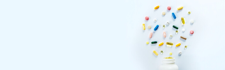 Supplements and vitamins on a white background. Selective focus.