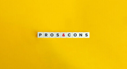 Pros and Cons Phrase on Letter Tiles on Yellow Background. Minimal Aesthetics.