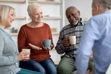 Positive senior people having group therapy with psychologist - Powered by Adobe