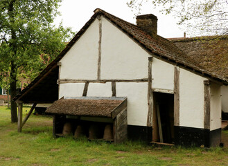 Fototapeta na wymiar White barn in a rural landscape, Bokrijk, Belgium