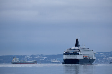 RoRo passenger and car ferry Pearl Seaways sail away from port of Oslo, Norway on sunny day with...