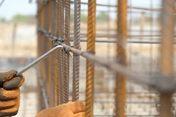 Almaty, Kazakhstan - 04.24.2018 : The territory of the construction site. Workers fix a metal frame for concrete.