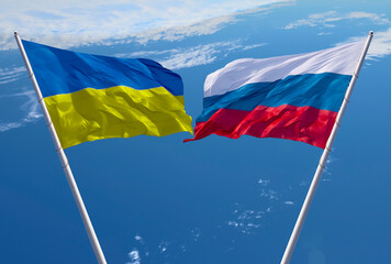 Flags of Russia and Ukraine against a dramatic cloudy sky. Escalation of the conflict. The concept of confrontation.