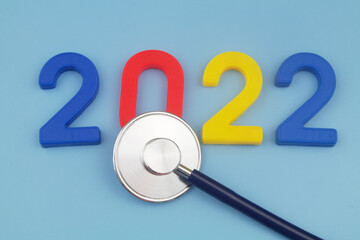 Stethoscope and numbers 2022. Forecast for year 2022 or medicine and health care in 2022.