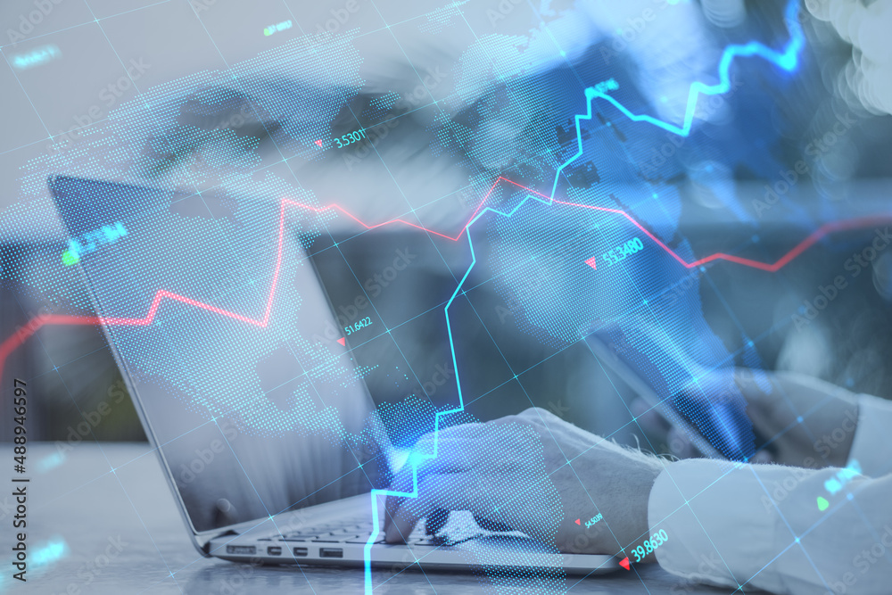 Poster close up of businessman hands using laptop keyboard and smartphone with creative glowing blue map ho