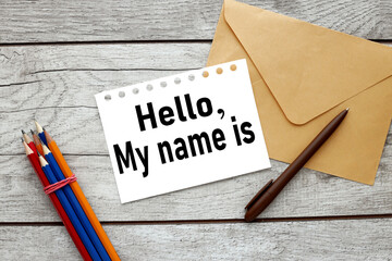 HELLO MY NAME IS. text on white paper near envelope on wooden table