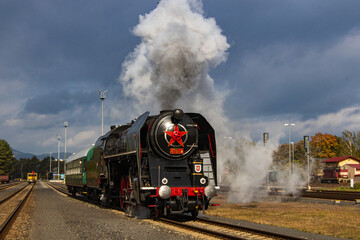 Fototapeta na wymiar departure of a steam locomotive at a Czech railway station
