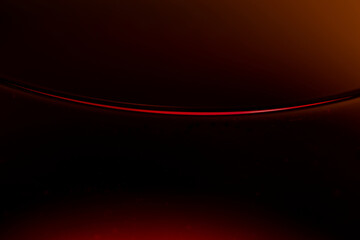 View on the line between red wine and glass in the dark