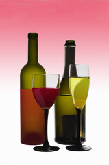 A glass of white wine, a glass of red wine and two bottles. 