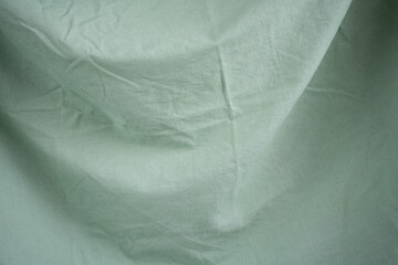 wrinkled basil green background